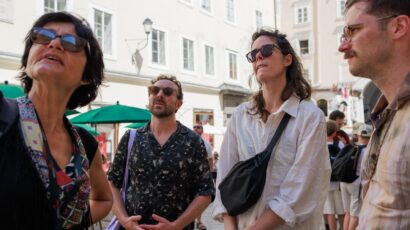 State-certified guide Annabelle Blanc leading an engaging historical sightseeing walk during our Food Tours in Salzburg.